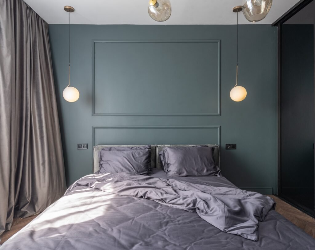 bed with grey quilt