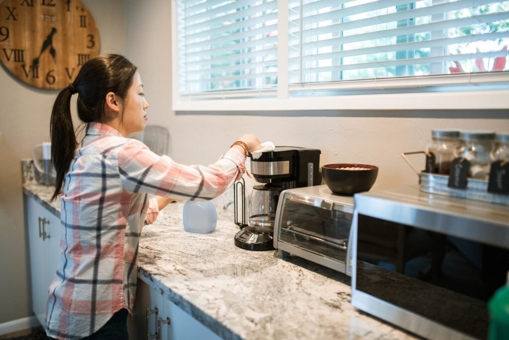 homemaker cleaning kitchen