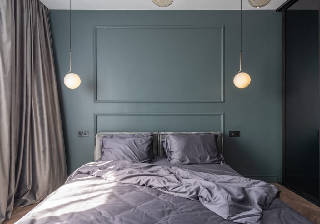 bed with grey quilt
