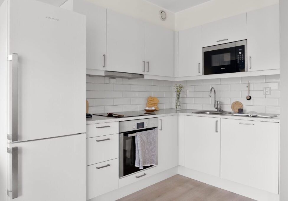 This <a href="https://www.pexels.com/photo/kitchen-interior-with-white-tiles-and-furniture-19966764/">Photo</a> was taken by <a href="https://www.pexels.com/@alex-tyson-919593032">Alex Tyson</a> on Pexels.