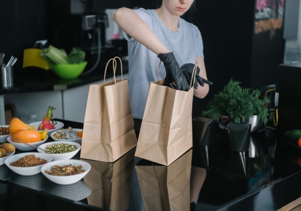 This <a href="https://www.pexels.com/photo/a-person-in-gray-shirt-wearing-black-gloves-inserting-items-on-brown-paper-bag-6613043/">Photo</a> was taken by <a href="https://www.pexels.com/@mikhail-nilov">Mikhail Nilov</a> on Pexels.