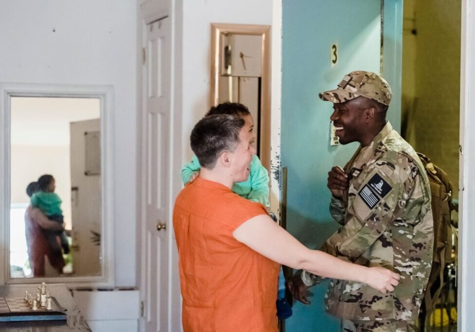 This <a href="https://www.pexels.com/photo/a-man-wearing-a-military-uniform-standing-beside-a-woman-carrying-a-child-7985485/">Photo</a> was taken by <a href="https://www.pexels.com/@george-pak">George Pak</a> on Pexels.