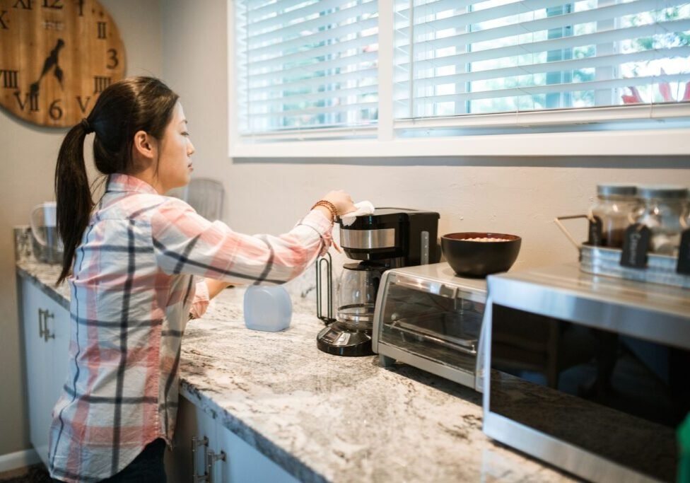 homemaker cleaning kitchen